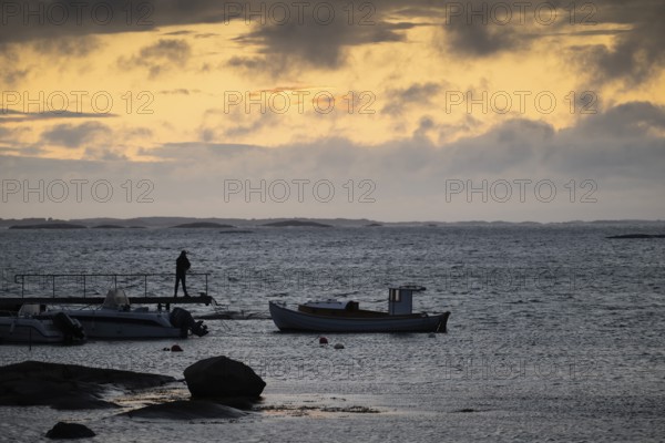 Small bay, archipelago, jetty with angler, Resö Island, Bohuslän, Skagerrak, Sotenäs, Västra