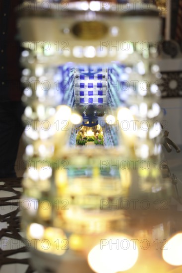 Syrian artisans display handmade artistic pieces to visitors at the Damascus International Fair.