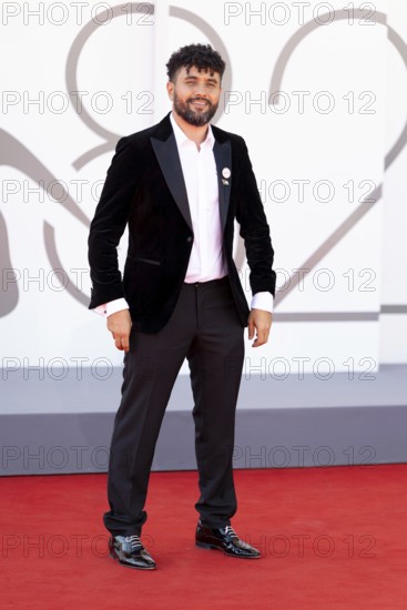 Venice, Italy - 3 September 2025: Amine Bouhafa wears a sticker in the colours of the Palestine