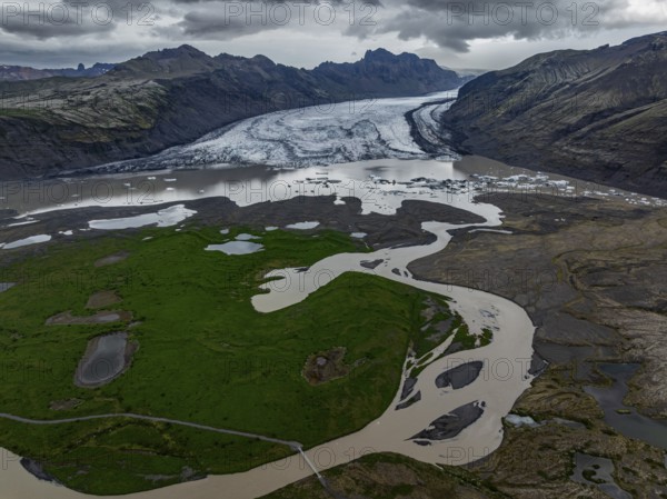Glacier, glacier tongue, glacier lake, mountains, cloudy, aerial view, panorama, summer,