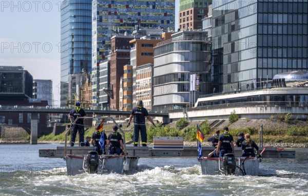 Exercise run of a multi-purpose pontoon on the Rhine, Medienhafen, the skipper gives instructions