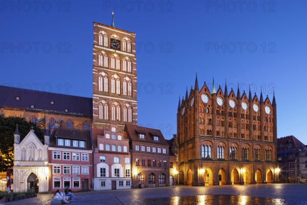 Night view, left back St. Nikolai Church first mentioned 1276, 102 metres high, front left, white,