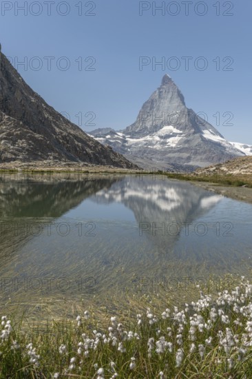A marvellous view of the Matterhorn, which lies majestically above a calm lake and reflects its
