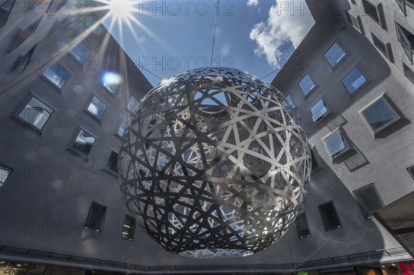 Steel sphere, Sphere, a work of art by Ólafur Eliasson, Fünf Höfe shopping arcade, Munich, Bavaria,