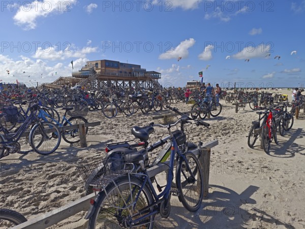 Car park for bicycles on the North Sea beach, Pfahlbau Strandbar 54° Nord, summer, sun, sand, on
