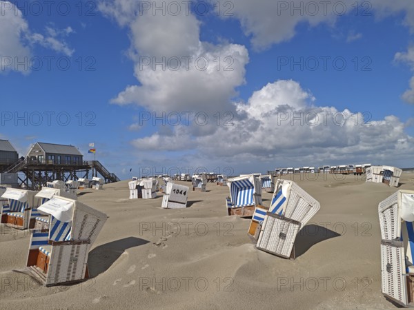 Sand drifts on the North Sea beach, blue sky, white clouds, summer, sun, sand, pile dwelling,