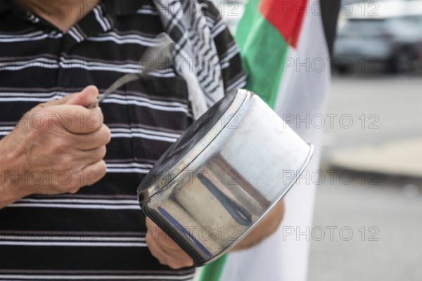 Detroit, Michigan USA - 23 August 2025 - Protesters rally at Eastern Market, banging empty pots to