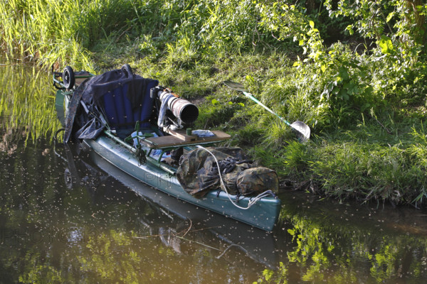 Kayak of a nature photographer in the water, Müritz National Park, Mecklenburg-Western Pomerania,