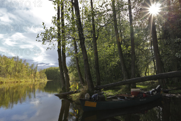 Canoe by nature photographers in Drosedower Bek, Müritz National Park, Mecklenburg-Western
