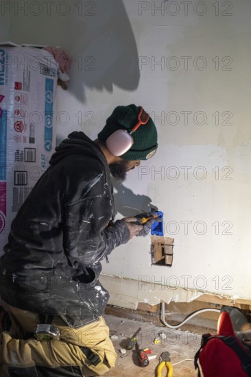 Detroit, Michigan - Workers remodel a house in the Morningside neighborhood that had been vacant
