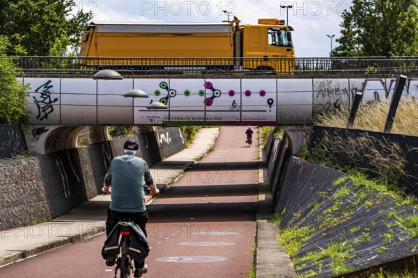 Rijnwaalpad long-distance cycle path, near the village of Elst, subway of the A15 motorway, wide