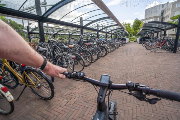 Bicycle parking spaces and boxes on the cycle path in the east of Utrecht, at Utrecht-Lunetten