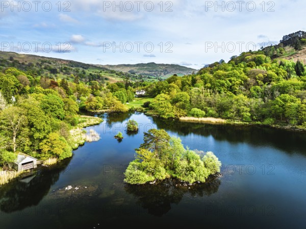 Farms and Mountains over road A591 from a drone, Grasmere Lake, Grasmere, Ambleside, Lake District,