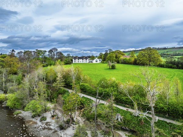 Farms and mountains over Ullswater Lake from drone, Pooley Bridge, Lake District National Park,