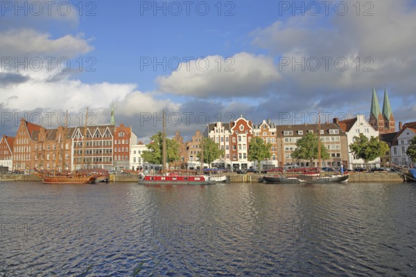 Ships on the banks of the Stadttrave, houses, cityscape, sailing ship, quay, harbour, steeples of