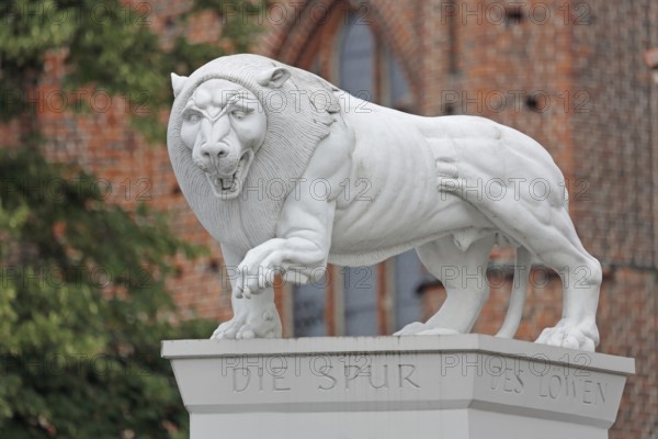 White Lion Monument by Peter Lenk 1996 with inscription The Trace of the Lion and monument to the