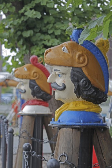 Colourful Swedish heads as landmarks, historical wooden head with face and four eyes, Swedish head