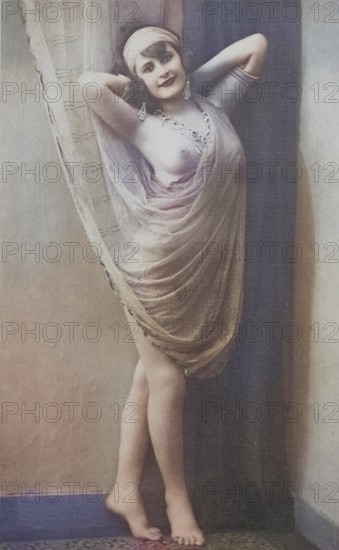 Female nude from around 1899, erotic postcard, playgirl, woman in antique veil posing on a wall,