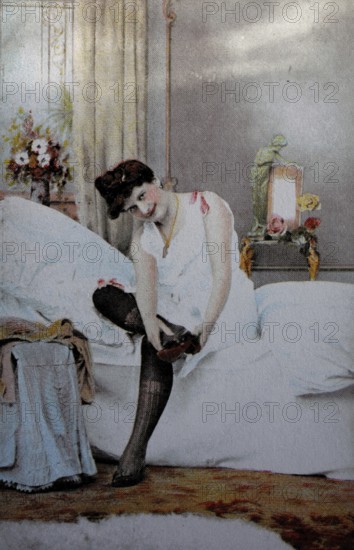 Female nude from around 1899, erotic postcard, playgirl, woman sitting on the bed and putting on