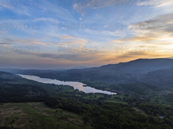 Sunset over Mountains and Coniston Water from drone, Lake District National Park, Cumbria, England,