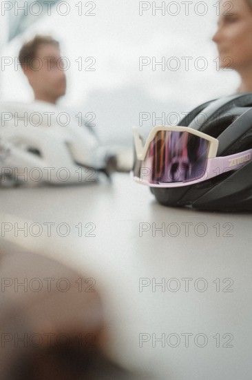 Young man taking a coffee break while riding his racing bike on Lake Garda. Sunny weather and dolce