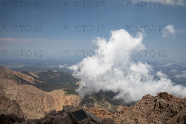 Colorado Springs, Colorado - Clourds rise near the summit of Pikes Peak, a 14, 115' mountain in