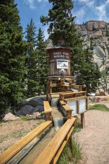Colorado Springs, Colorado - A sluice along the highway to the Pikes Peak summit offers tourists a