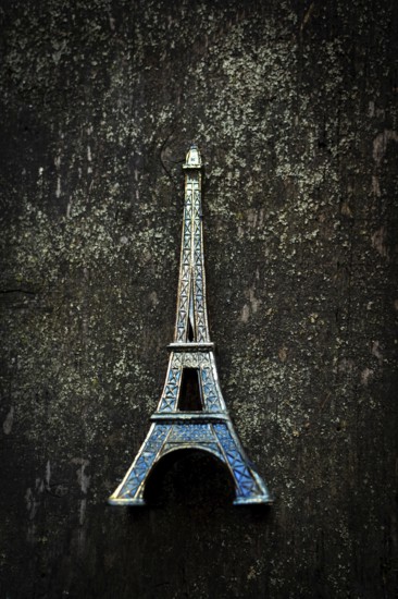 Vibrant blue Eiffel Tower keychain highlights detailed craftsmanship as it stands out against a