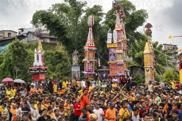 JOWAI, INDIA - JULY 14: People from the Pnar community march in a circle around a Rot as they