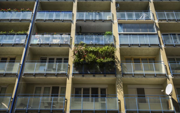 Balcony filled with flowers and plants on an apartment building in the city centre of Bratislava,