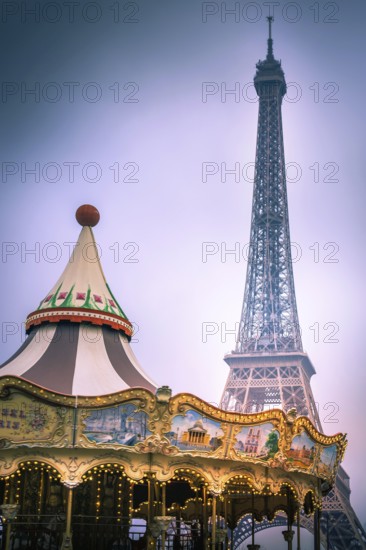 A vintage carousel spins joyfully in a park, with the Eiffel Tower towering majestically in the
