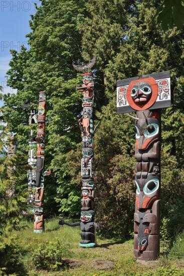 Totem poles, Chief Skedans Mortuary Totem Pole and Ga'akstalas Totem Pole, Stanley Park, Vancouver,