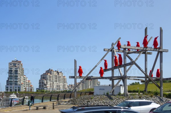 Rode Pinguins, Red Penguins, artwork by Belgian artist William Sweetlove in the harbour of Breskens