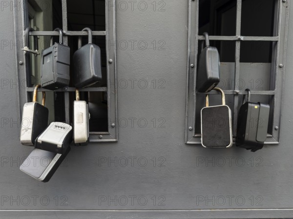 Key boxes on a grille of a basement window for flat flats in the city centre of Bratislava,