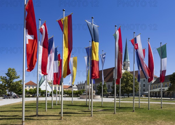 National flags at Kapellplatz with the collegiate parish church of St Philip and St James, place of