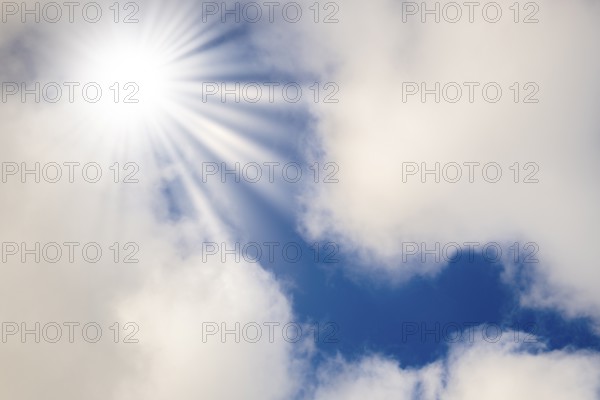 Symbolic image, global warming, heat, bright sunshine penetrates thin clouds and illuminates the