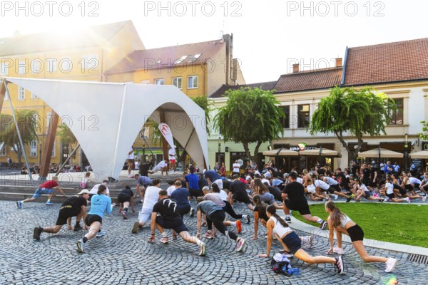An event by a local fitness centre takes place on a stage on Peace Square, Capital of Culture 2026,