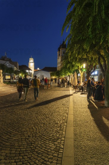 Night shot of the Peace Square in the old town centre of Trencín, in the background the Piarist