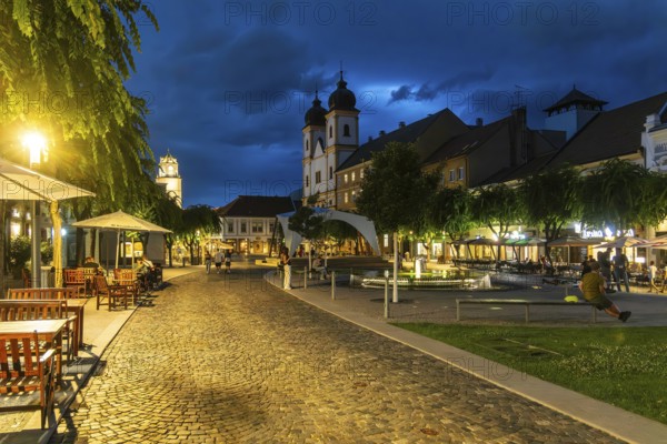 Night shot of the Peace Square in the old town centre of Trencín, in the background the Piarist
