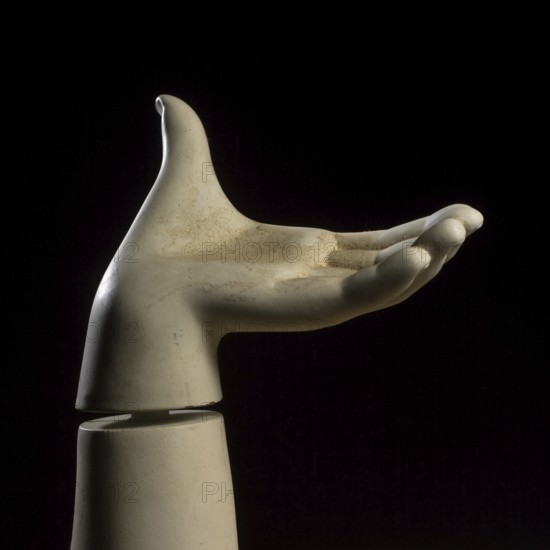 A detailed view of a mannequin hand with fingers slightly curled, creating a graceful pose against