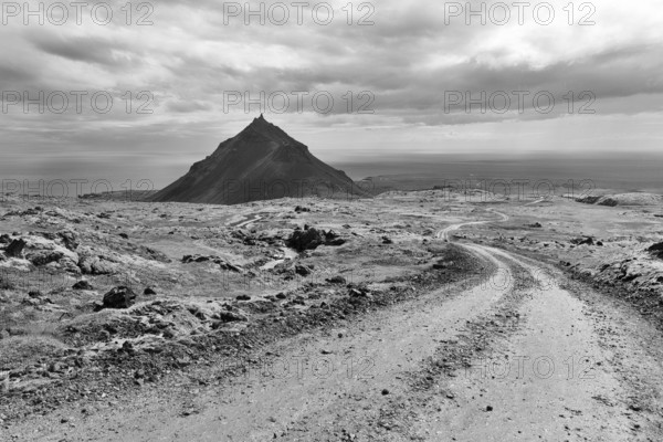 Barren mossy volcanic landscape, cone-shaped mountain Stapafell, monochrome, Arnarstapi, volcanic