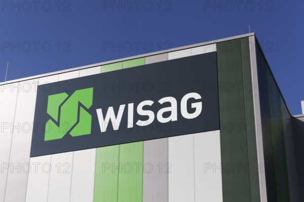WISAG, logo on industrial building, service company for building technology and infrastructure,