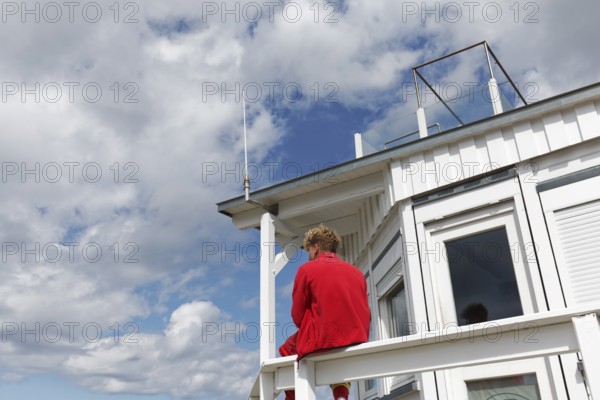 DLRG lifeguard at a rescue station, watching the beach, Kühlungsborn, Baltic Sea,