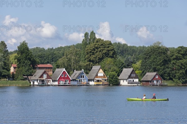 Boathouses, holiday homes on Lake Mirow, canoe, Mirow, Mecklenburg Lake District,