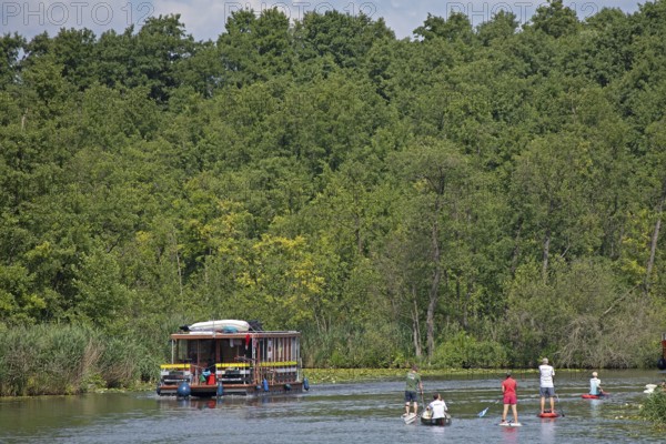Houseboat, canoe, stand-up paddler, canal between Mirower See and Zotzensee, Mecklenburg Lake