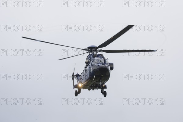 A helicopter with Emmanuel Macron (President of the French Republic) on board in front of a joint