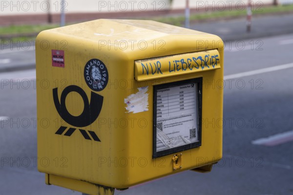 Deutsche Post letterbox, with stickers and graffiti, labelled Only love letters, Leverkusen, North
