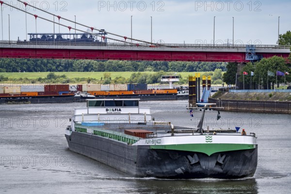 Barge enters the Vinckekanal, in the harbour of Ruhrort, container freighter on the Rhine, on an