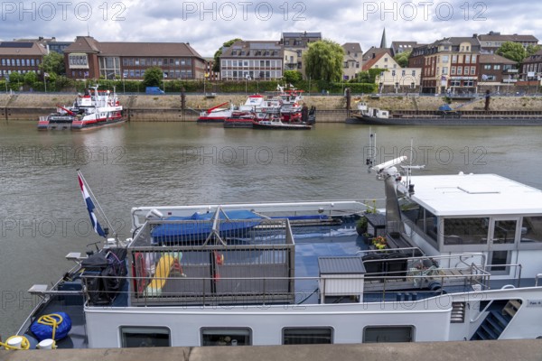 Barge, aft deck, with children's playground surrounded by a metal cage, for the safety of playing
