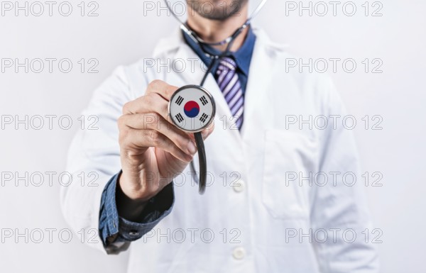 South Korea healthcare system, doctor holding stethoscope. South Korea health and medical insurance